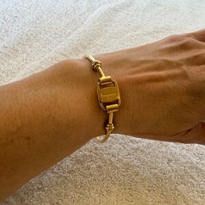 Salvatore Ferragamo Vintage Gancini gold-tone bangle bracelet.